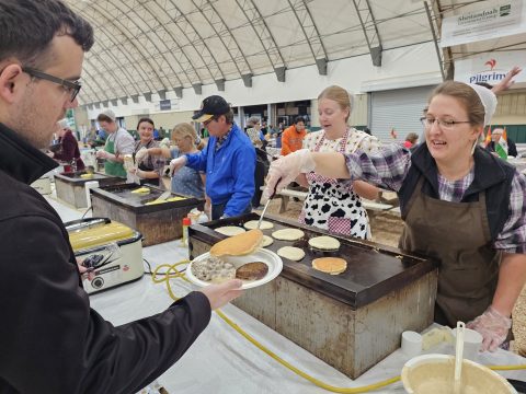 People serving breakfast