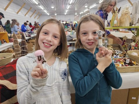 Children at the Ten Thousand Villages stand